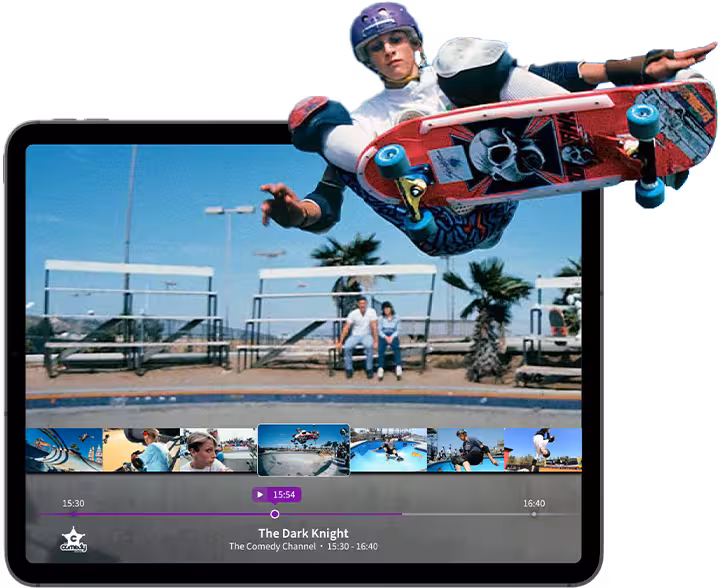 A skateboarder performs a jump over a ramp, showcasing skill and agility in an urban skate park setting.