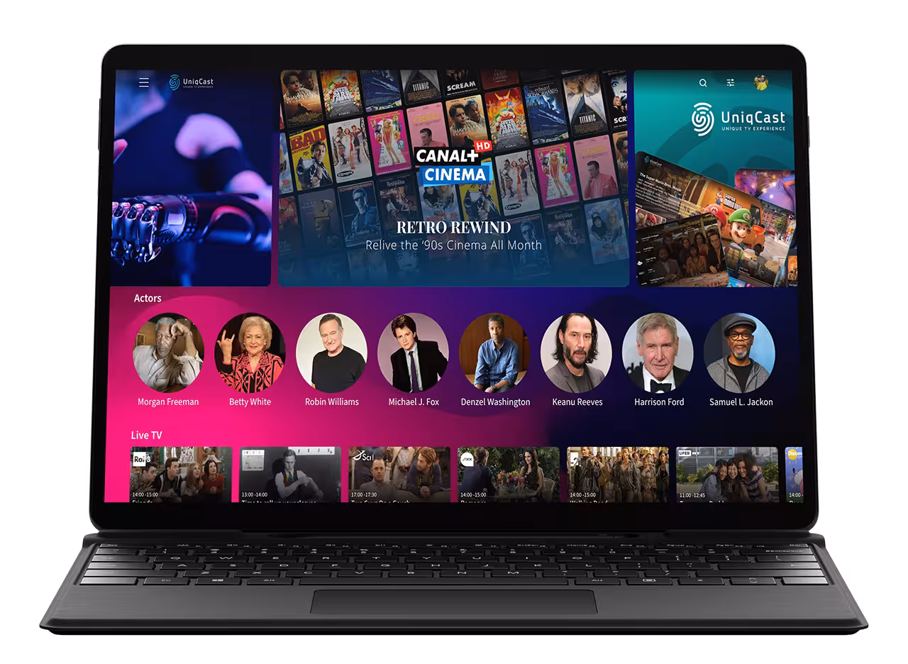 A laptop screen featuring the Uniqcast OTT Platform UI showcasing a selection of music videos.