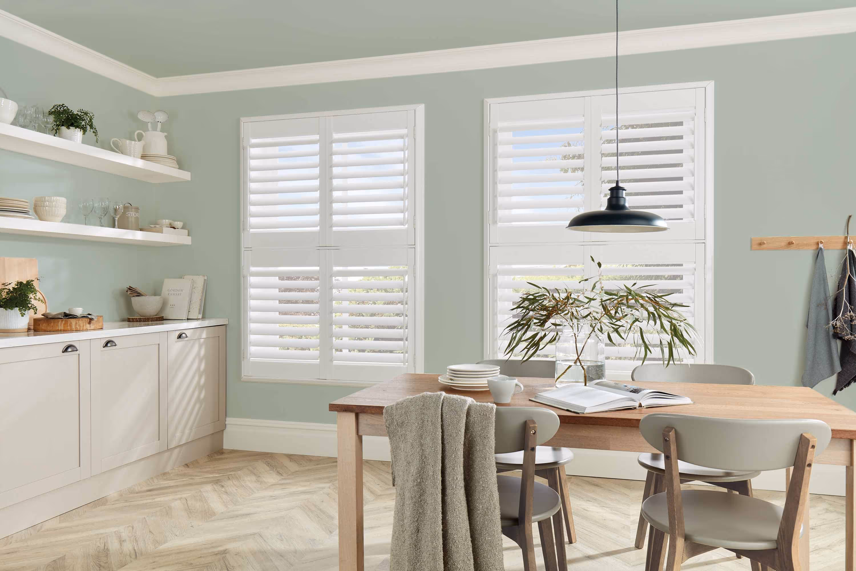 A kitchen featuring tier on tier shutters