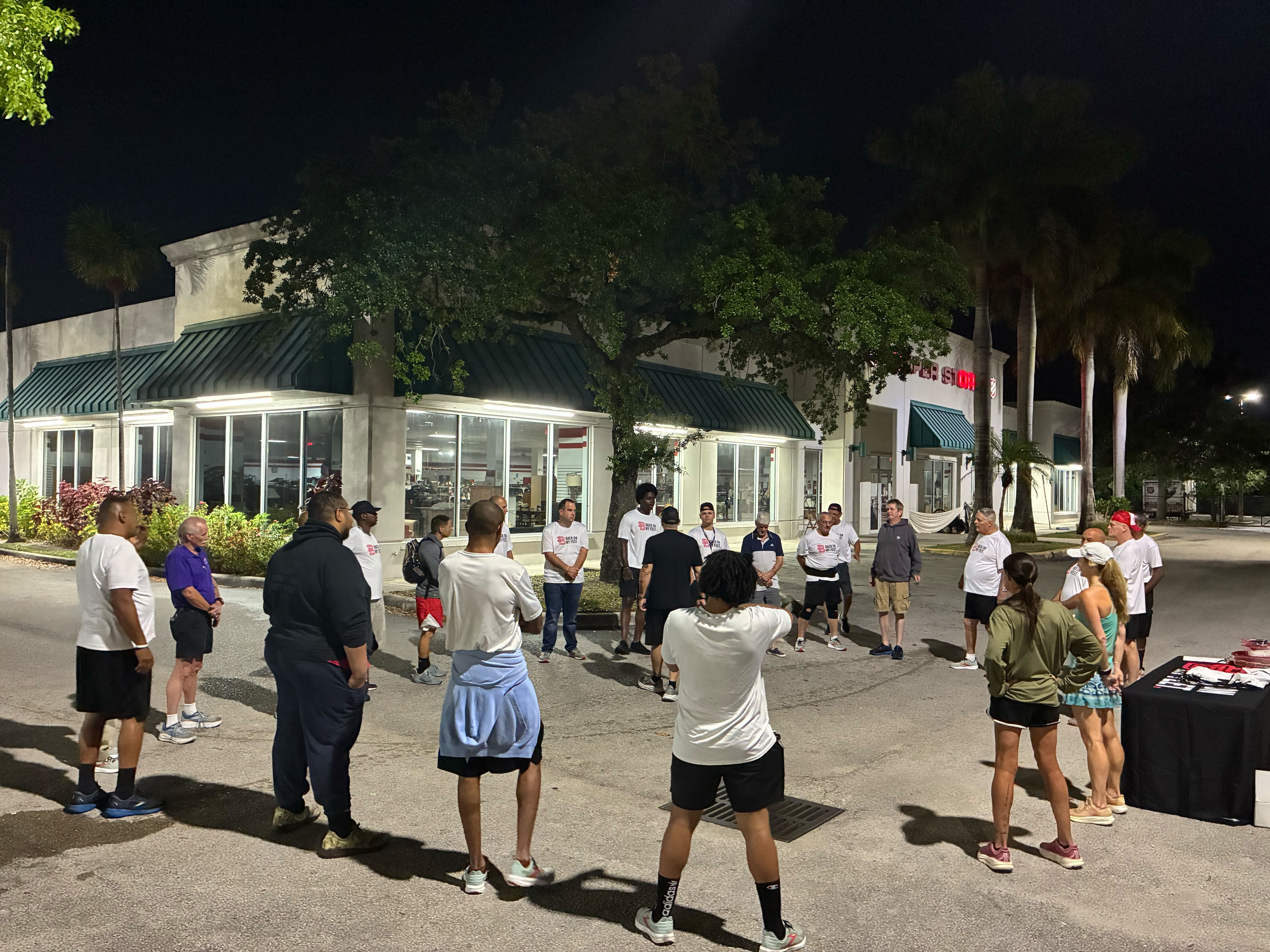 Back on My Feet members and volunteers gathering outside before a morning run