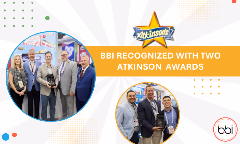 BBI Recognized with Two Atkinson Awards: two groups at the Atkinson's booth holding star trophies, with the Atkinson's logo