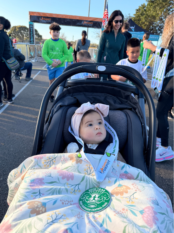 Baby in a stroller at the race