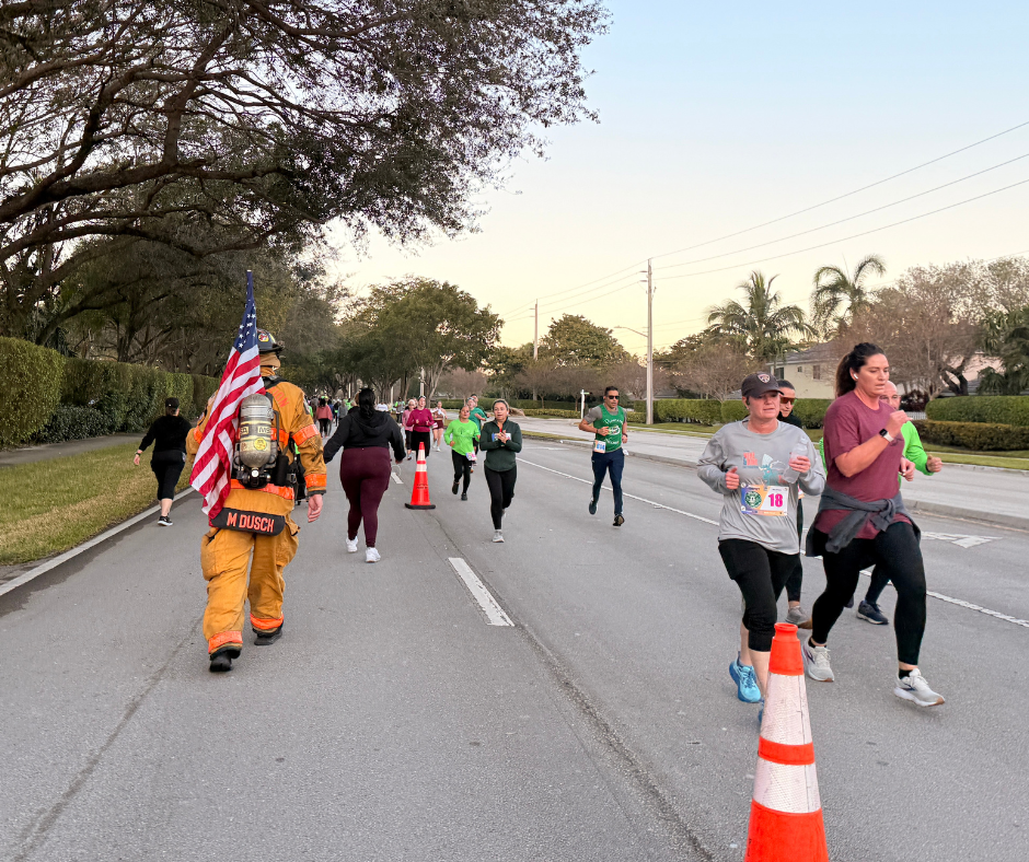 Runner in firefighter gear among 5K participants