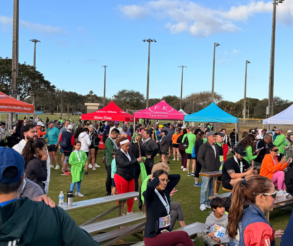 Crowd gathered near colorful event tents