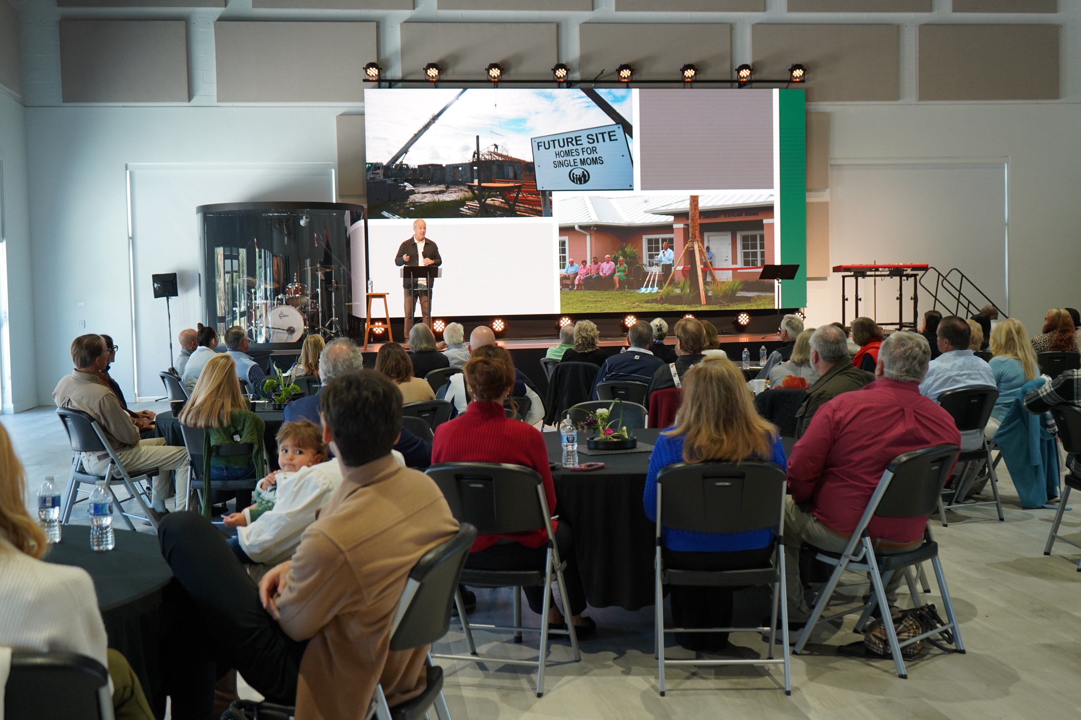Guests seated indoors for the dedication ceremony