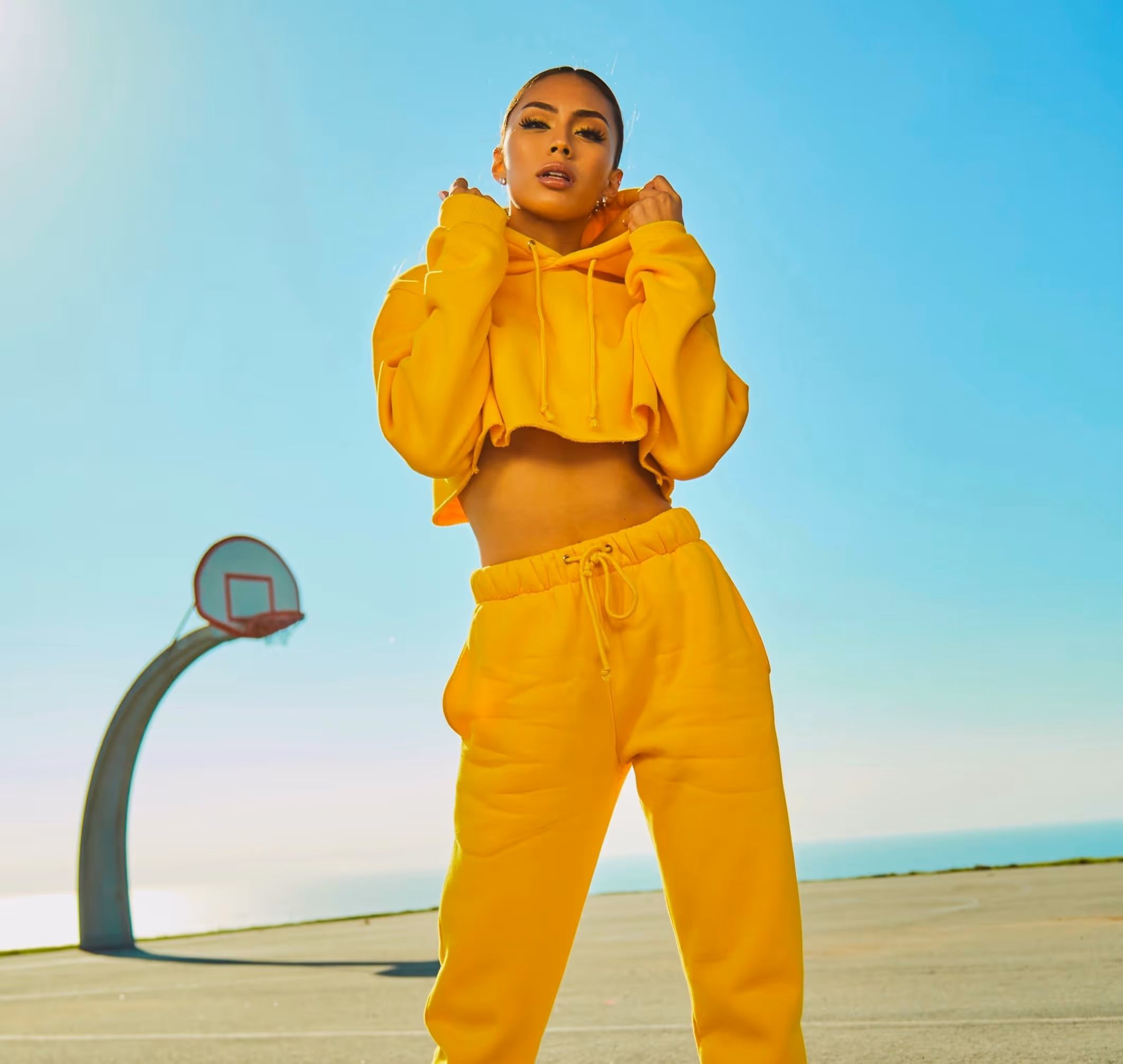 beauty school student in yellow hoody