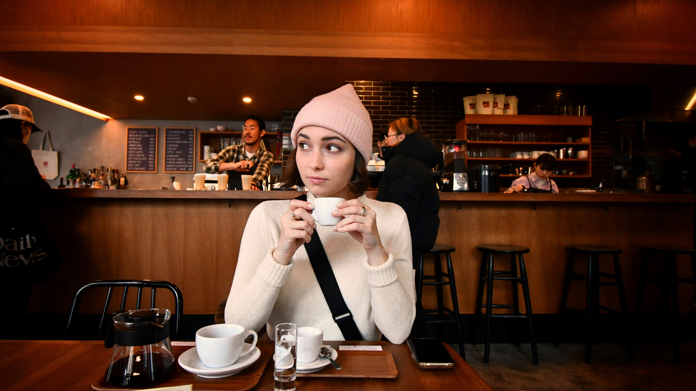 beauty school student studying at coffee shop in los angeles