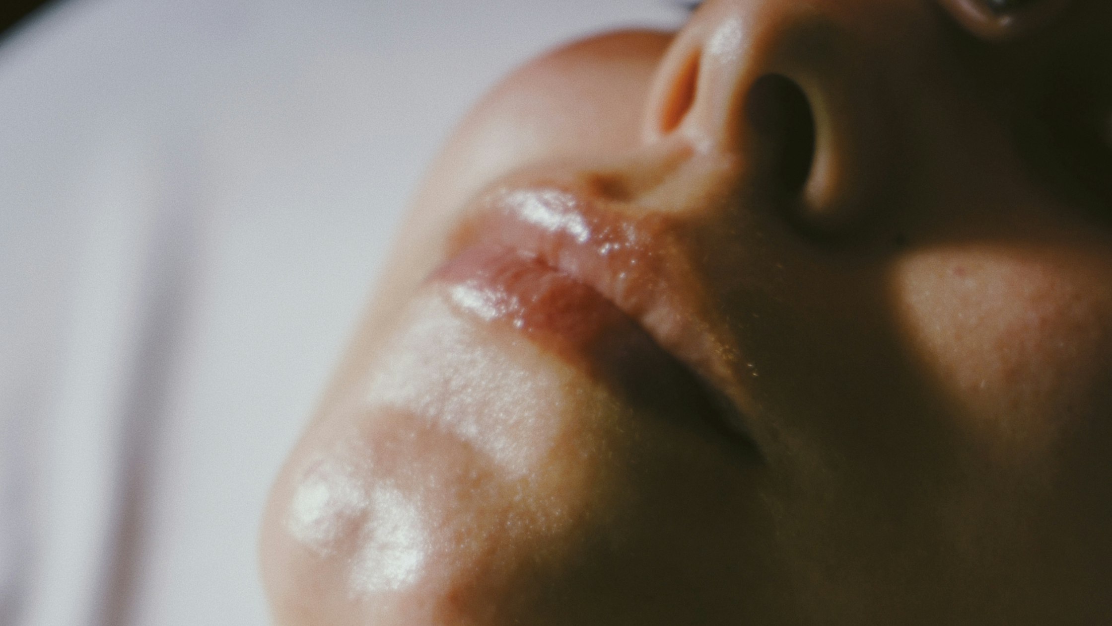 Esthetician performing a facial treatment on a client