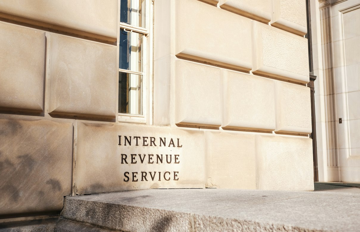 IRS building sign in Washington, D.C. The IRS issues the ITIN that Beyond accepts for beauty school enrollment.