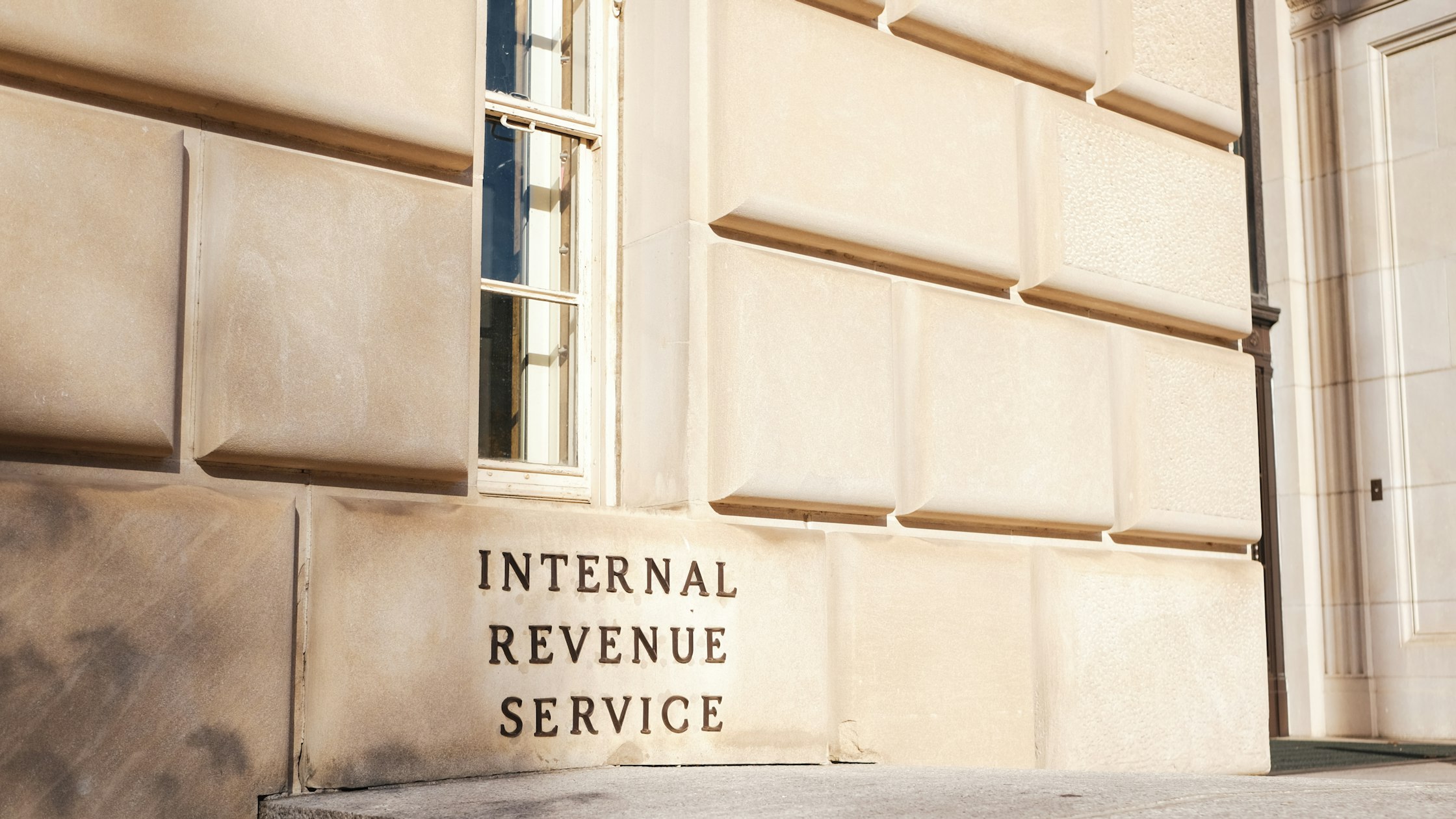 IRS building sign in Washington, D.C. The IRS issues the ITIN that Beyond accepts for beauty school enrollment.
