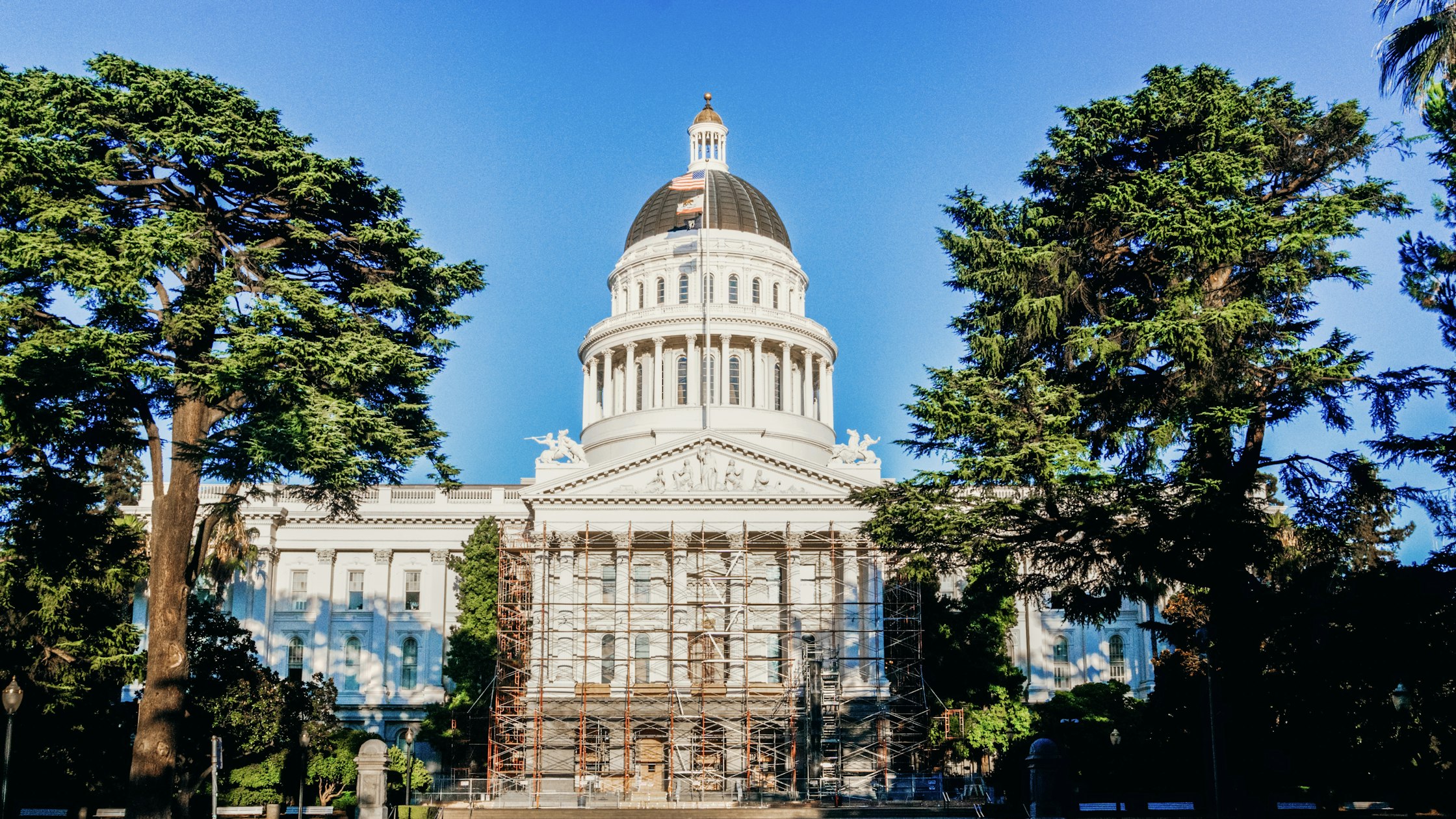 The California State Capitol building in Sacramento under a blue sky