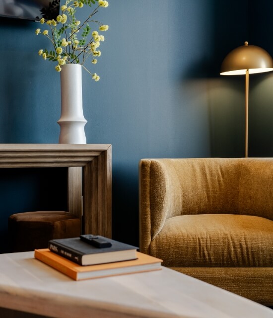 Furniture and accessories in multi-family speakeasy inspired lounge