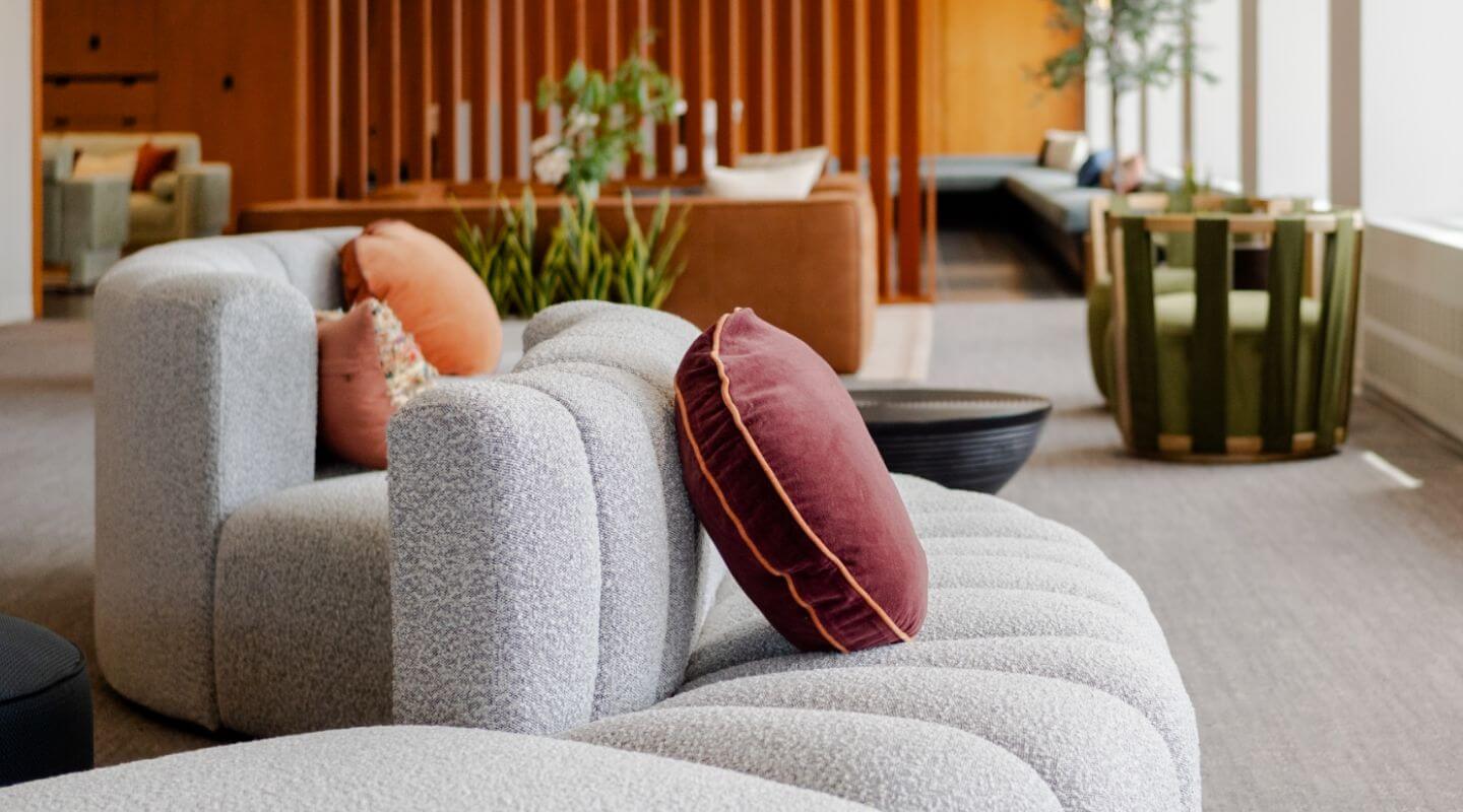 Couch and chair seating in multi-family amenity space