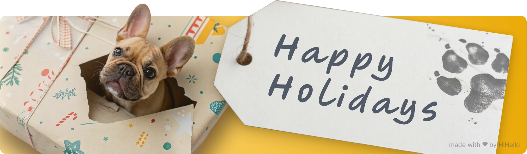 French bulldog popping out of wrapping paper with paw-print holiday tag.