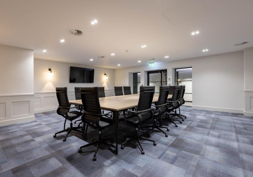 Spacious boardroom at Phoenix Business Park showcasing modern office amenities in Essex with professional meeting facilities.