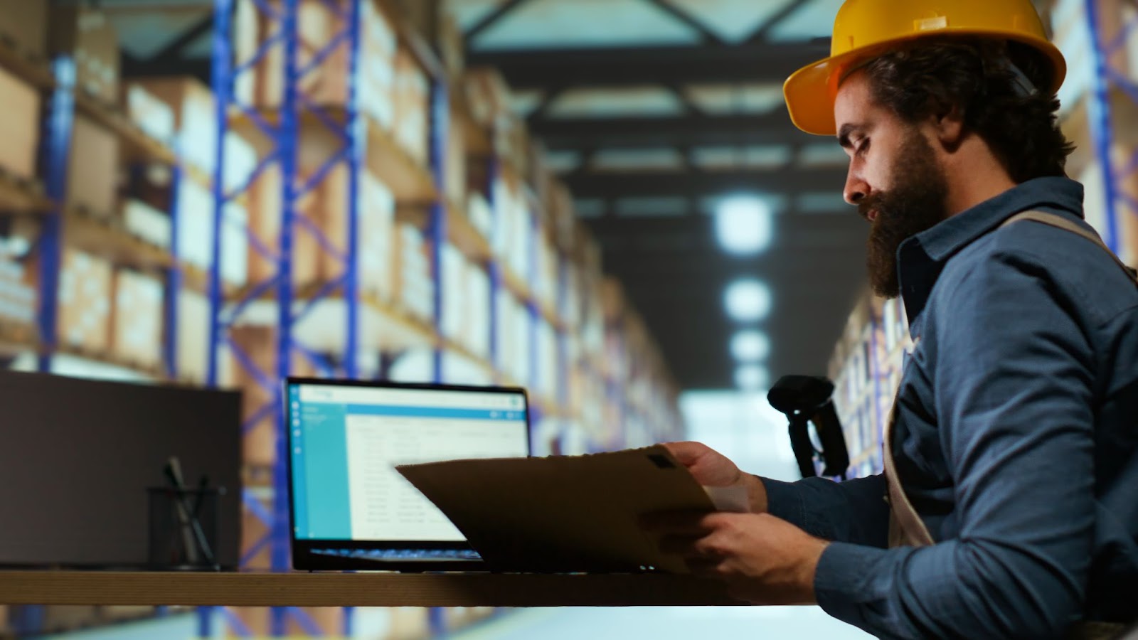 Alt text: Delivery service worker examines order details on files.