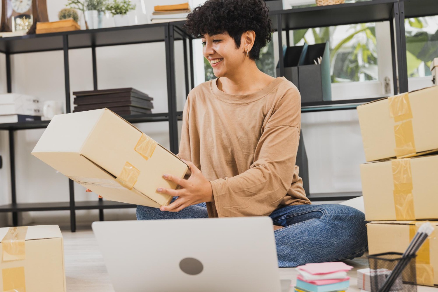 Alt text: An online business owner is checking a package.
