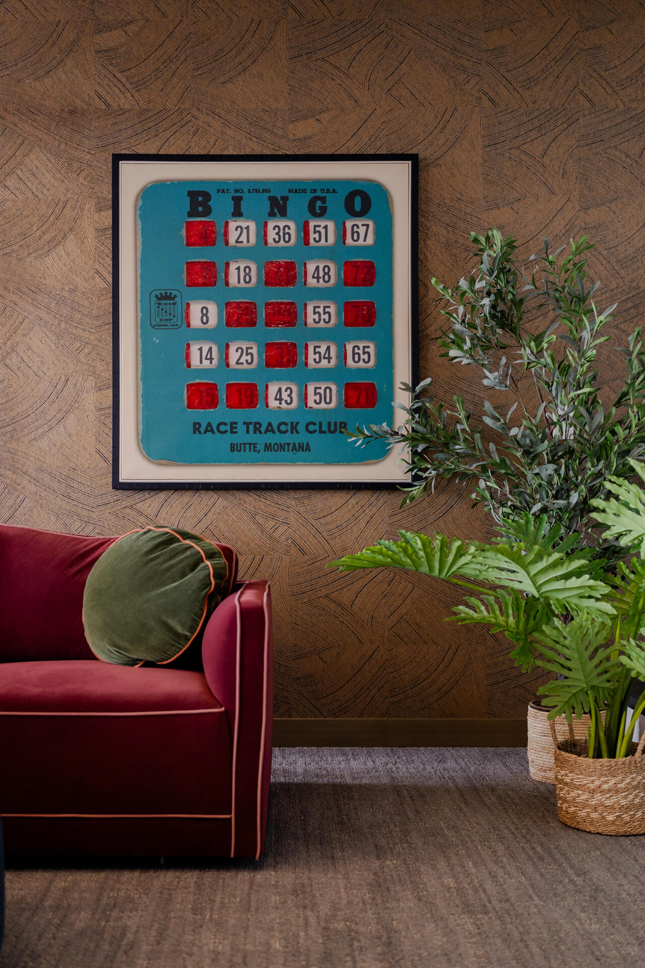 Red couch and Bingo art in Continental Tower lounge