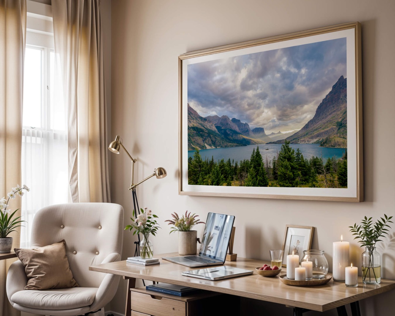 A framed photo of a sunset in Glacier National Park on a wall above a desk