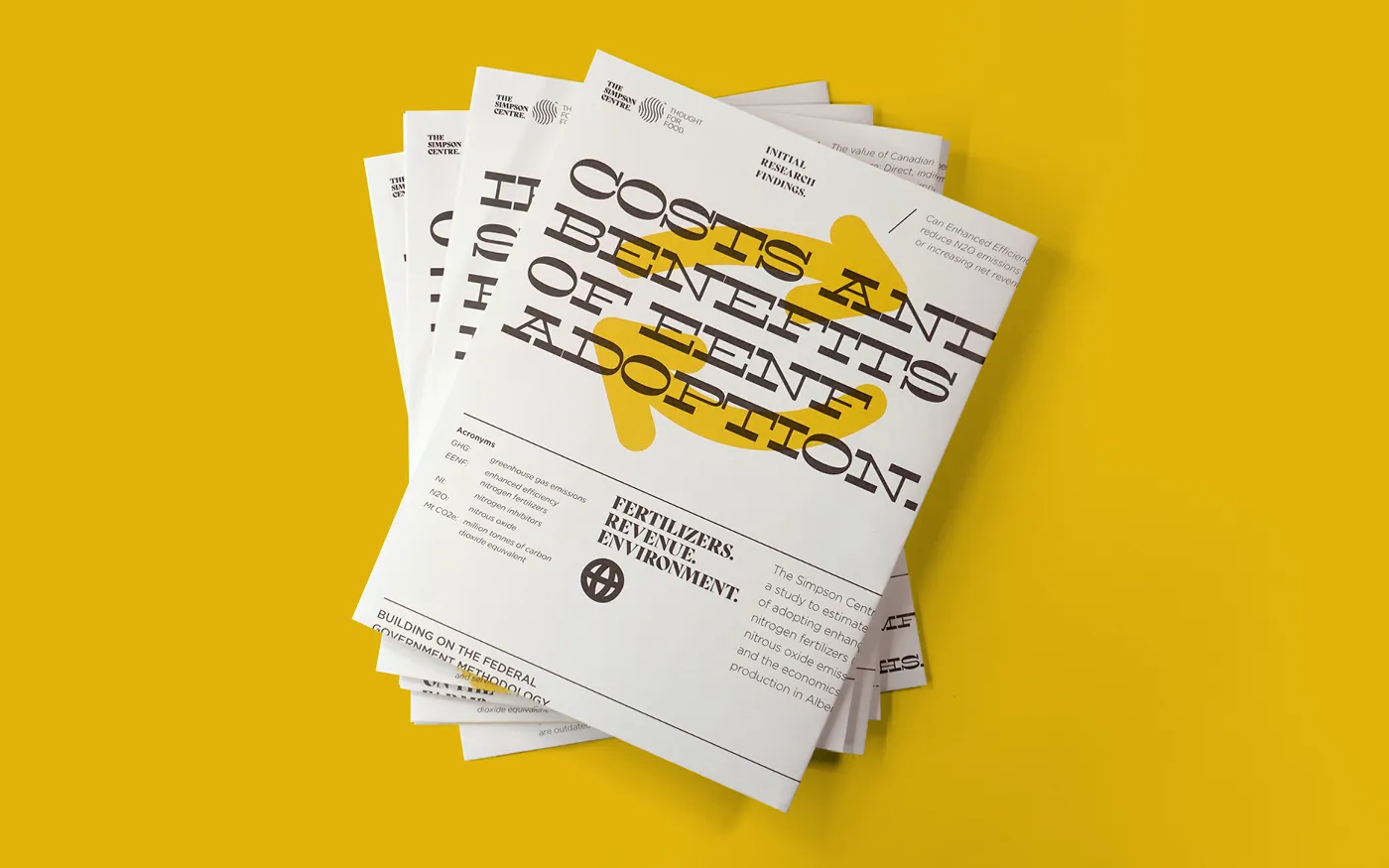 Stack of Simpson Centre research series reports titled 'Costs and Benefits of EEF Adoption' with subtitles on fertilizers, revenue, and environment against a yellow background.