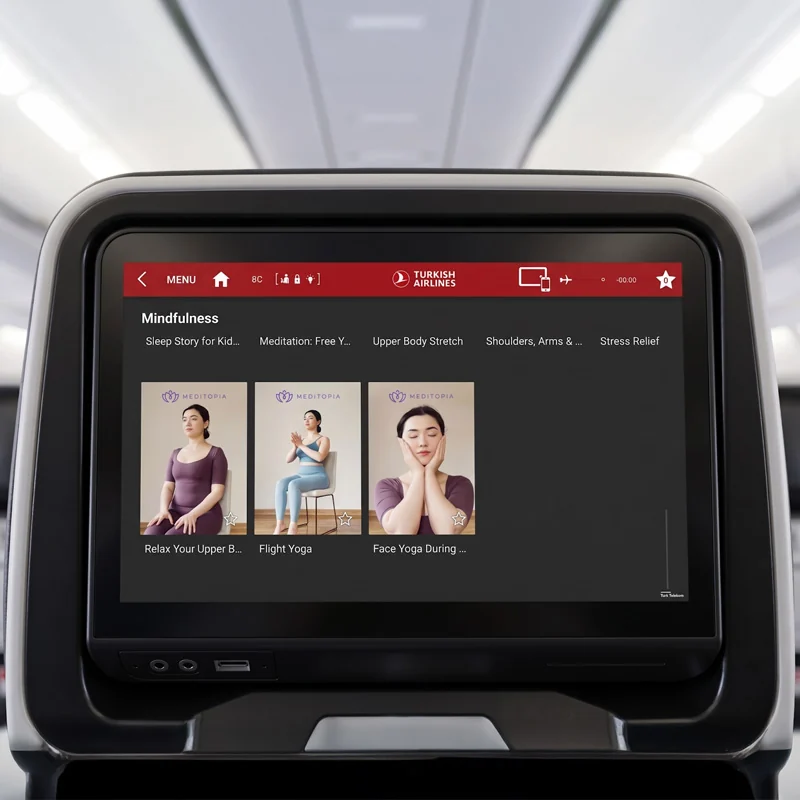 Turkish Airlines seatback screen showing Meditopia stretching and face yoga sessions