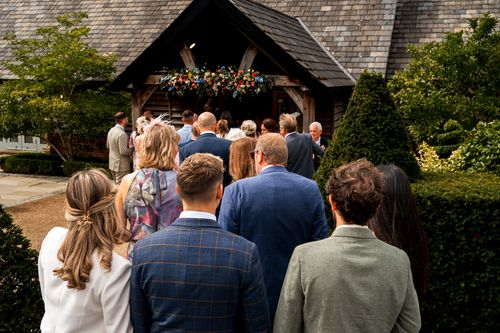 wedding guests queuing to get into ceremony