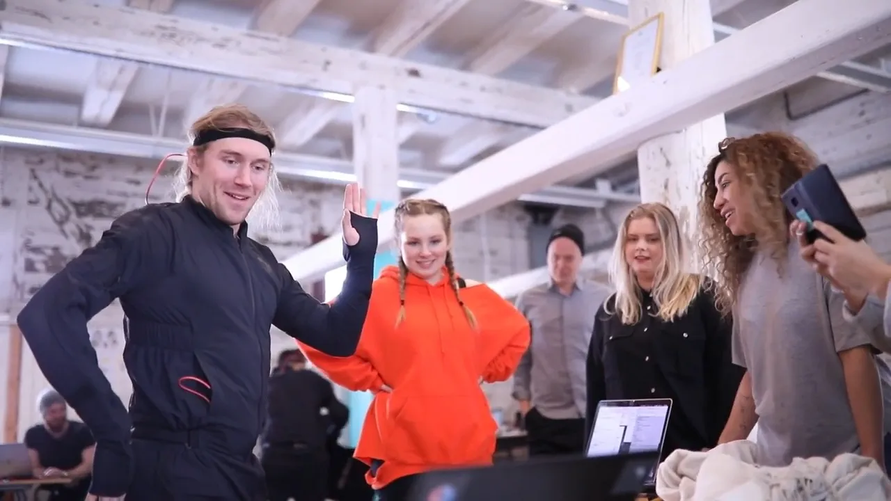 Teacher showing students how Rokoko mocap suit works in a class setting showcasing Rokoko use case for education and universities.