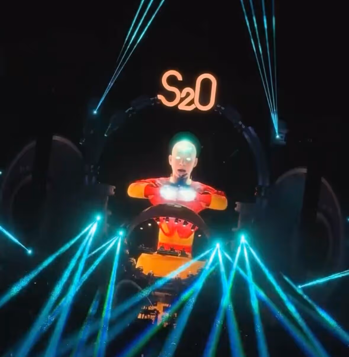 a picture of a live electronic music concert, showing an animated moving character on the big screens. The 3D character is made with Rokoko gear.