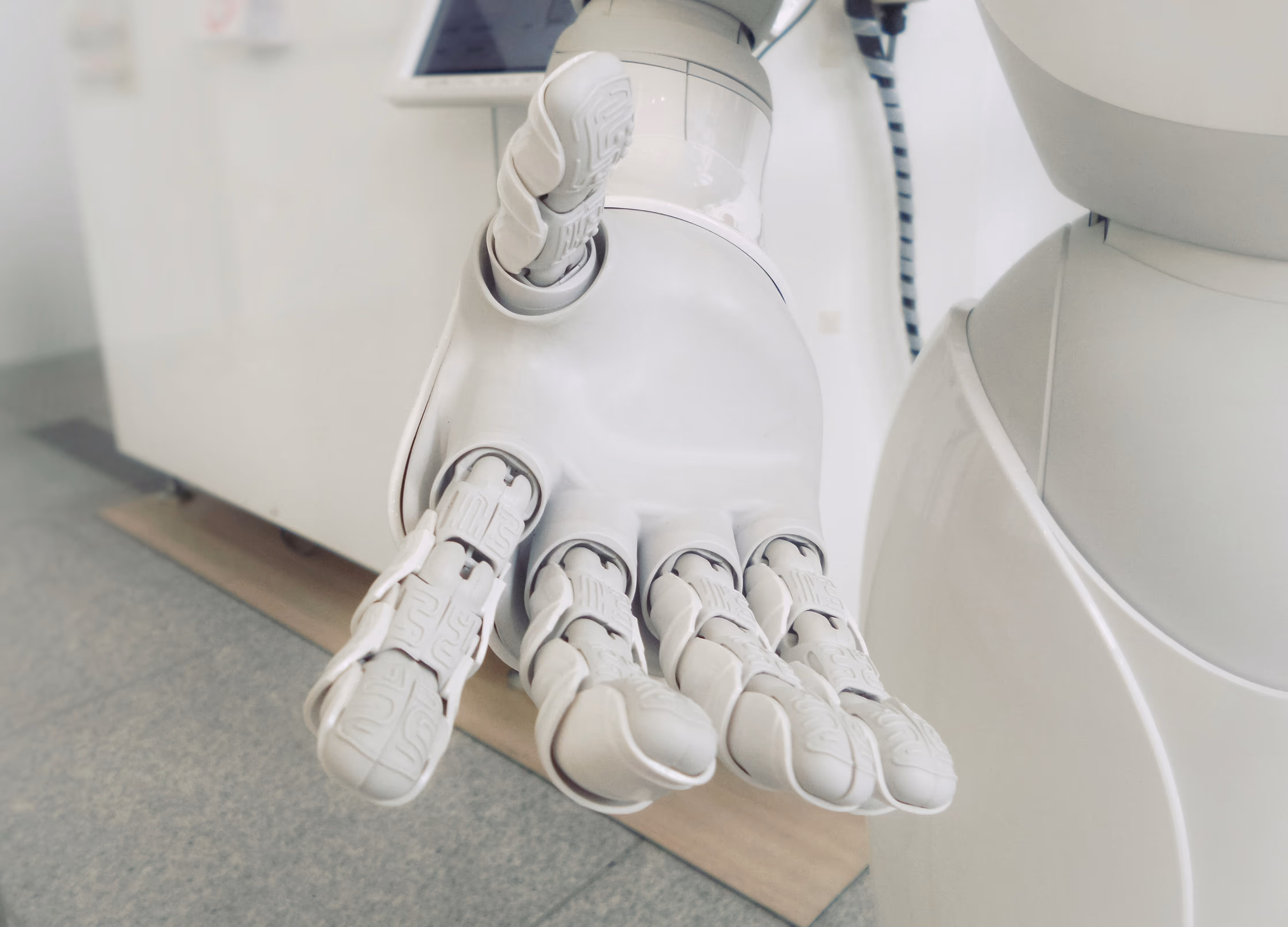 A white robot hand showcasing the Rokoko use-case in robotics and humanoid robot training.