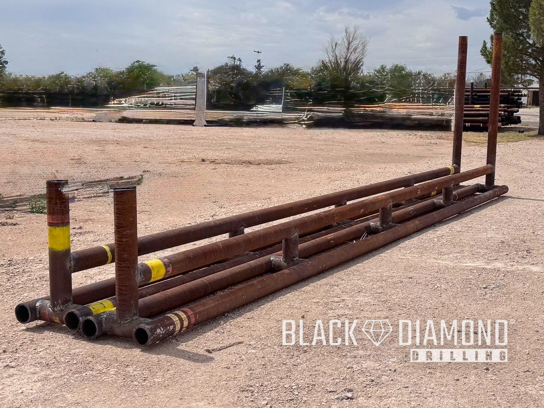 Heavy-duty long base pipe stackers made of 5 inch drill pipe for oilfield yard storage, inner 26 feet 10 inches long.