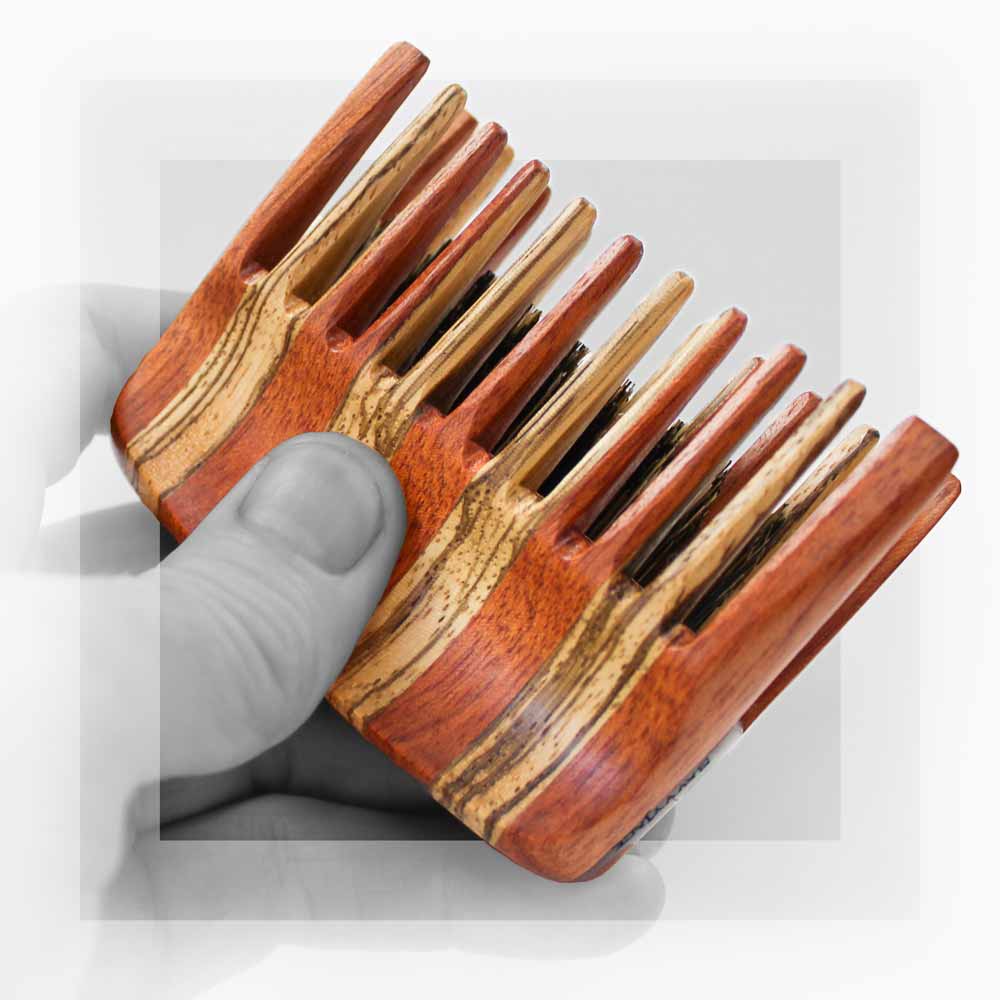 SavvyJack TripleJack beard comb and boar's hair brush. Shown in hand.