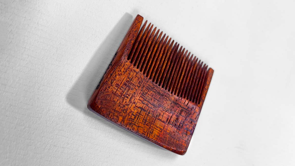 Bloodwood Pocket Pick comb finished with 3 coats of Sutherland Welles Murdoch's Hard Oil wood finish.