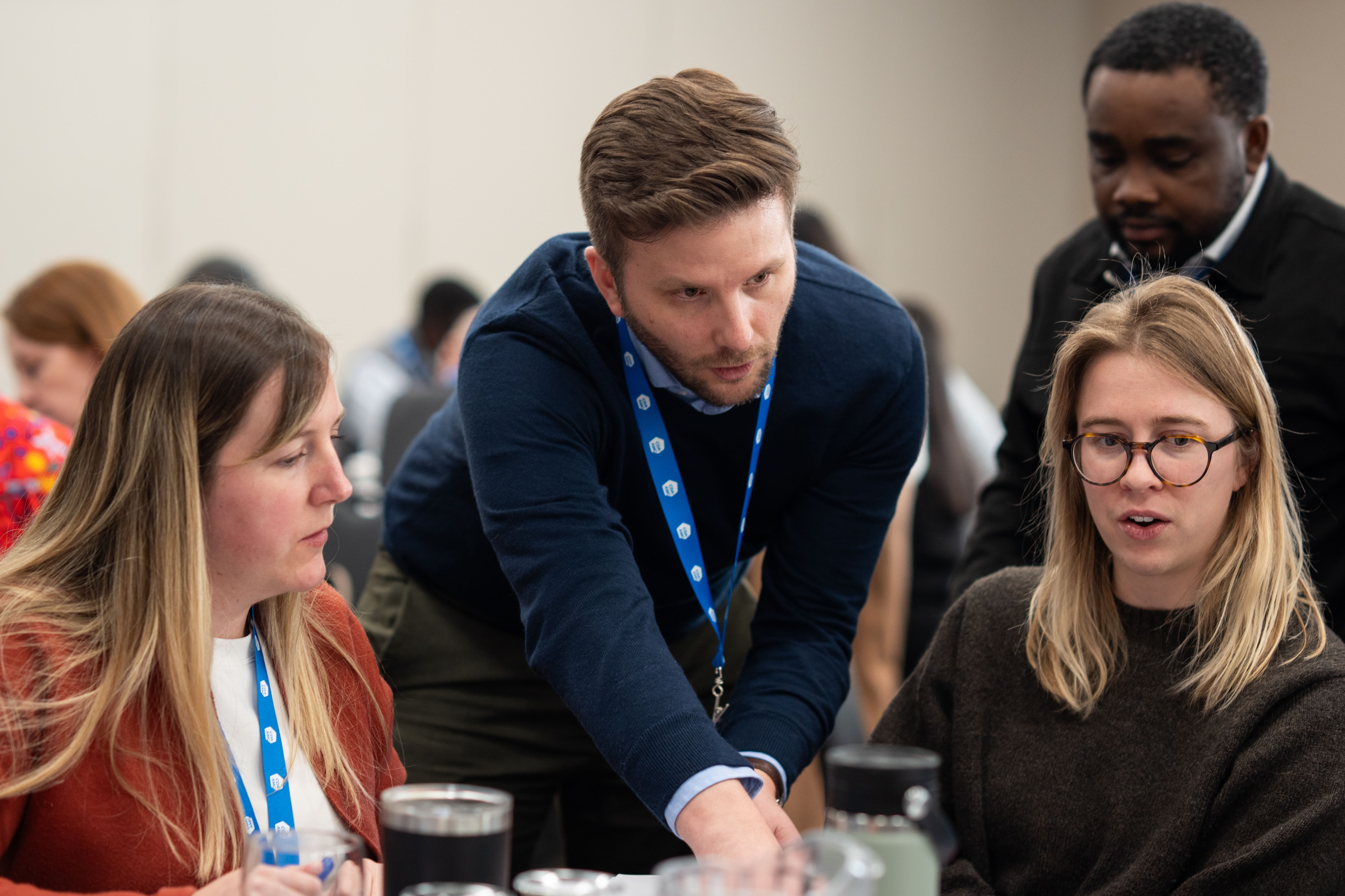 Group of people at a table at a workshop.