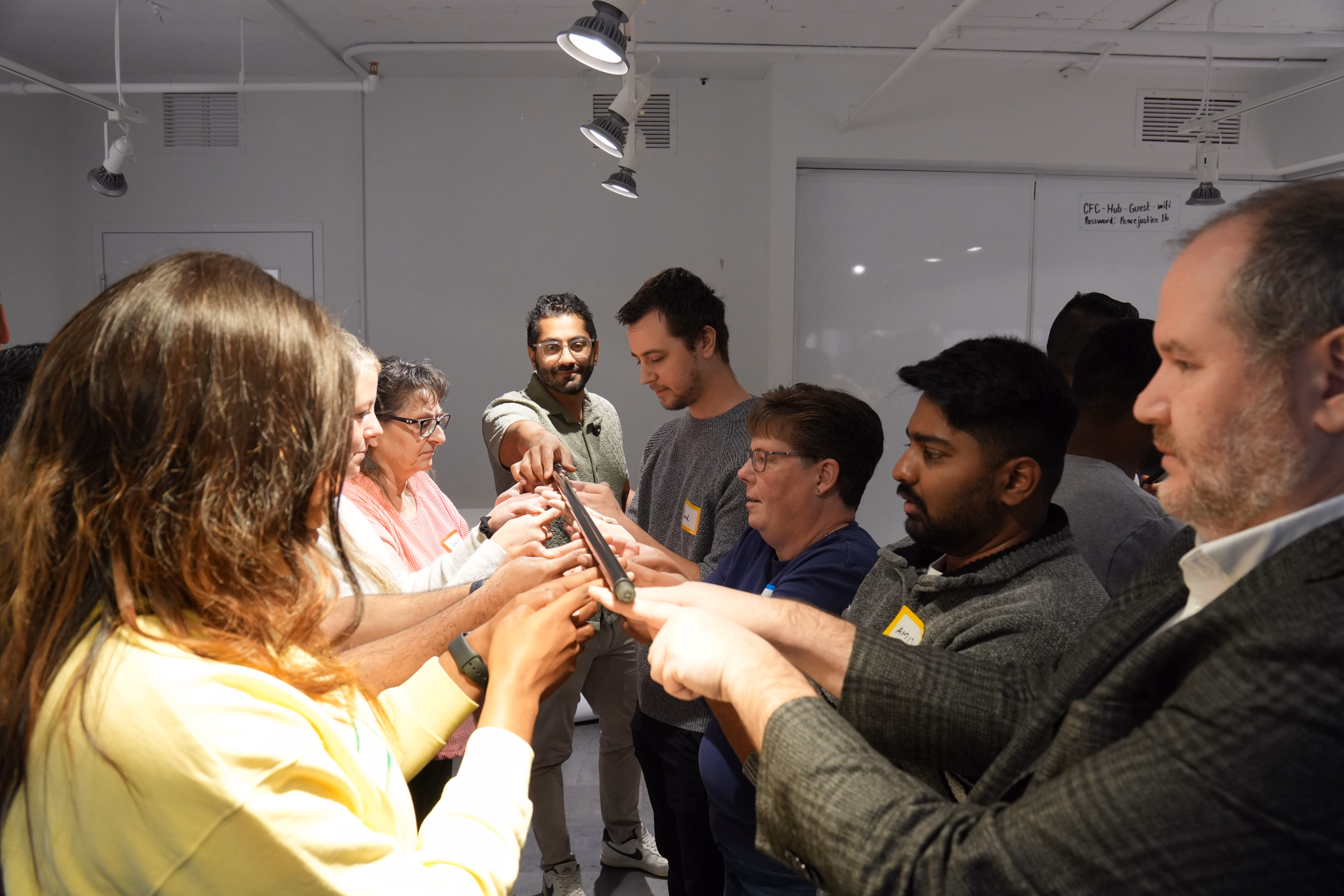 Team exercise, every hand on one object
