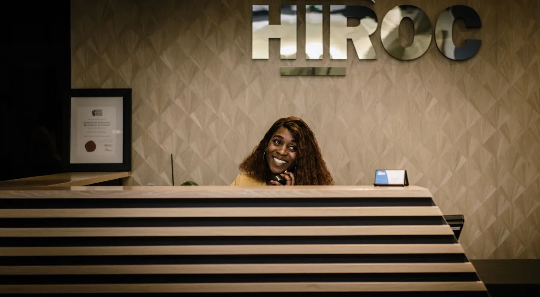 HIROC reception desk with the HIROC sign on the wall