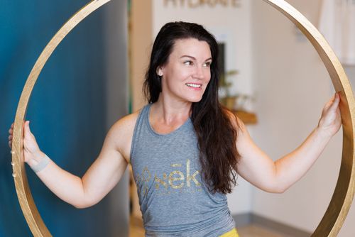 Cat Bryson, co-founder of sēk Sauna Studio, in the studio lobby in Franklin, Tennessee