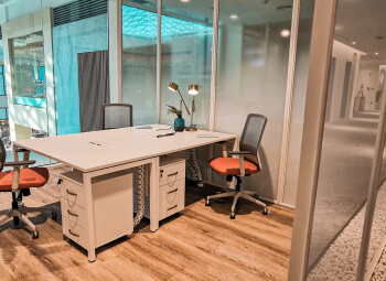 Event hall setup with tables and stage lighting