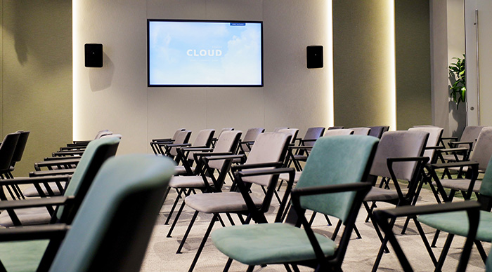 Auditorium banner showing stage and seating area