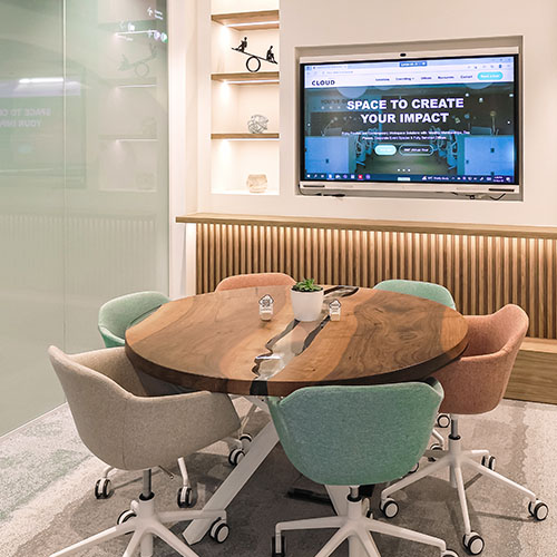 Modern meeting room at Cloud Spaces Roshn Front Riyadh with wooden table and screen