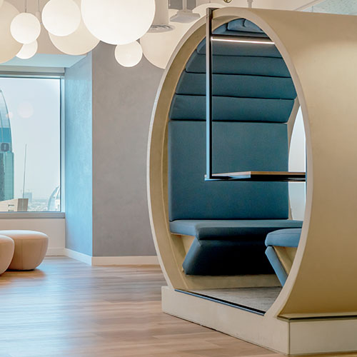 Acoustic circular booth seating at Cloud Spaces Kingdom Center designed for private conversations, focused work and modern workspace comfort.