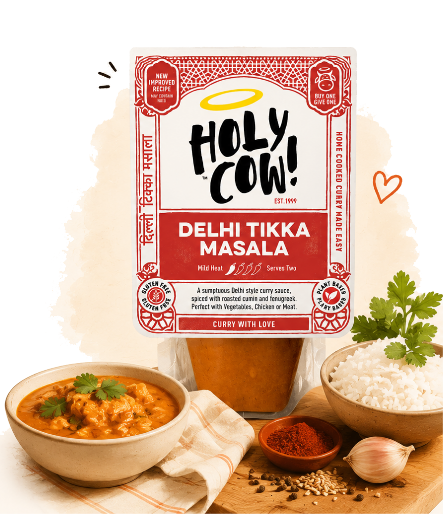 Holy Cow Delhi Tikka Masala curry sauce pack with a bowl of curry and fresh ingredients
