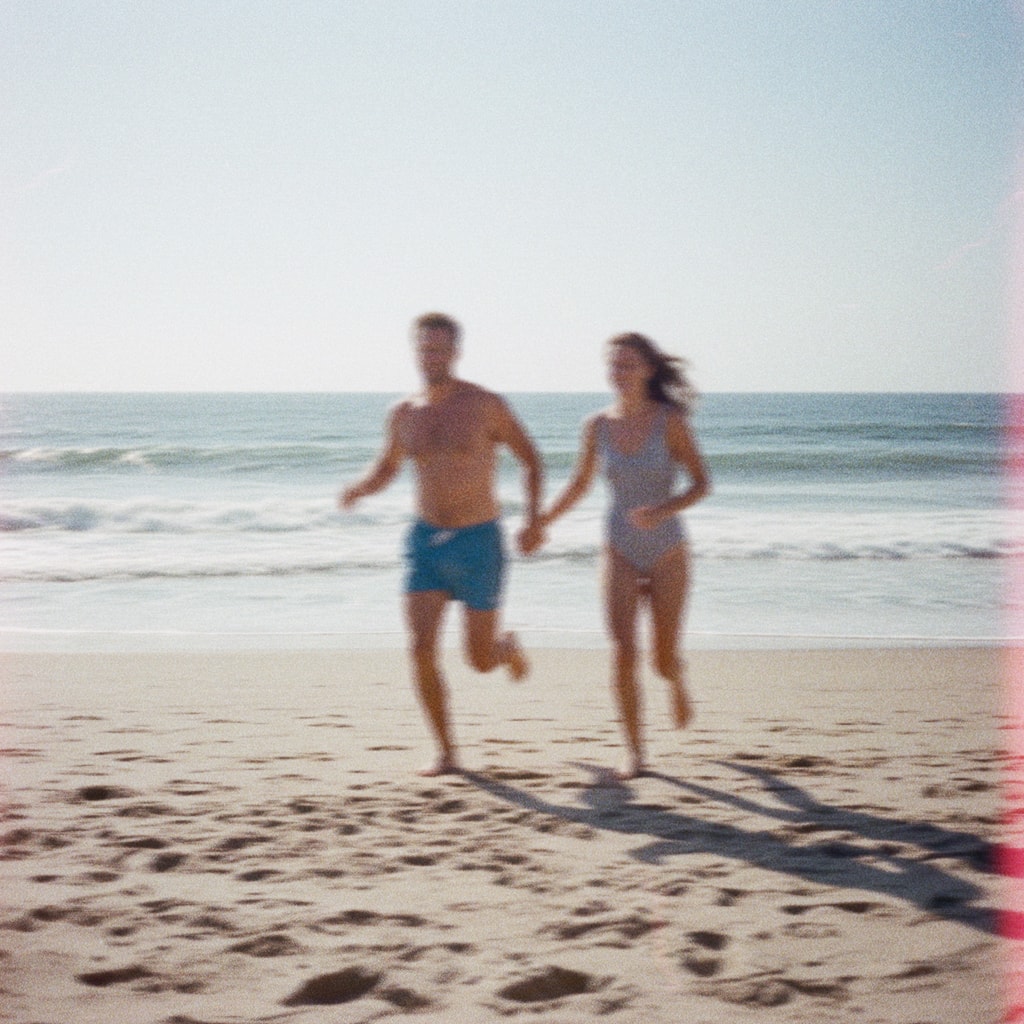 Couple running on a beach, film photo, Daypass lifestyle