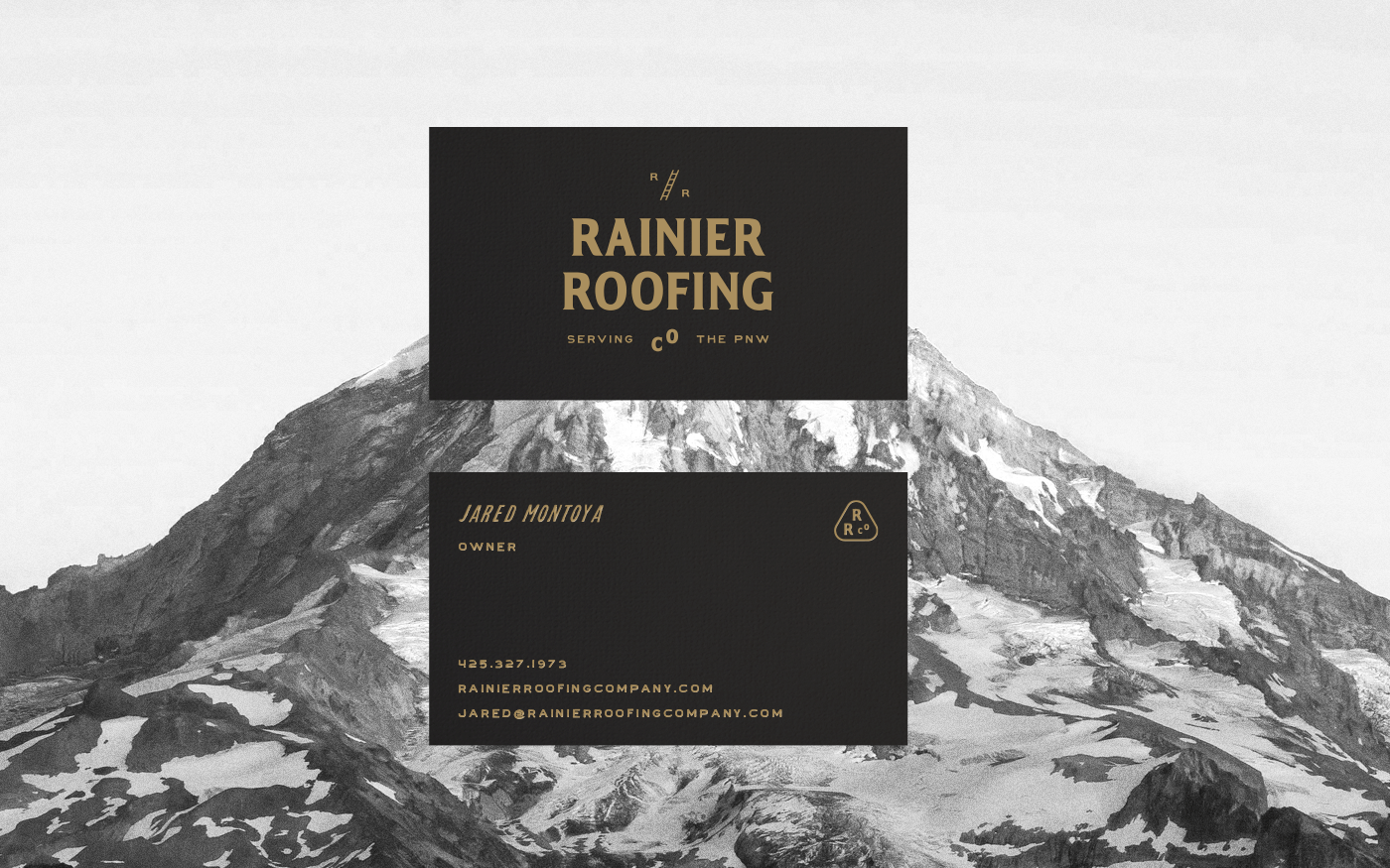 Rainier Roofing business cards — front and back in black and gold with mountain photography backdrop