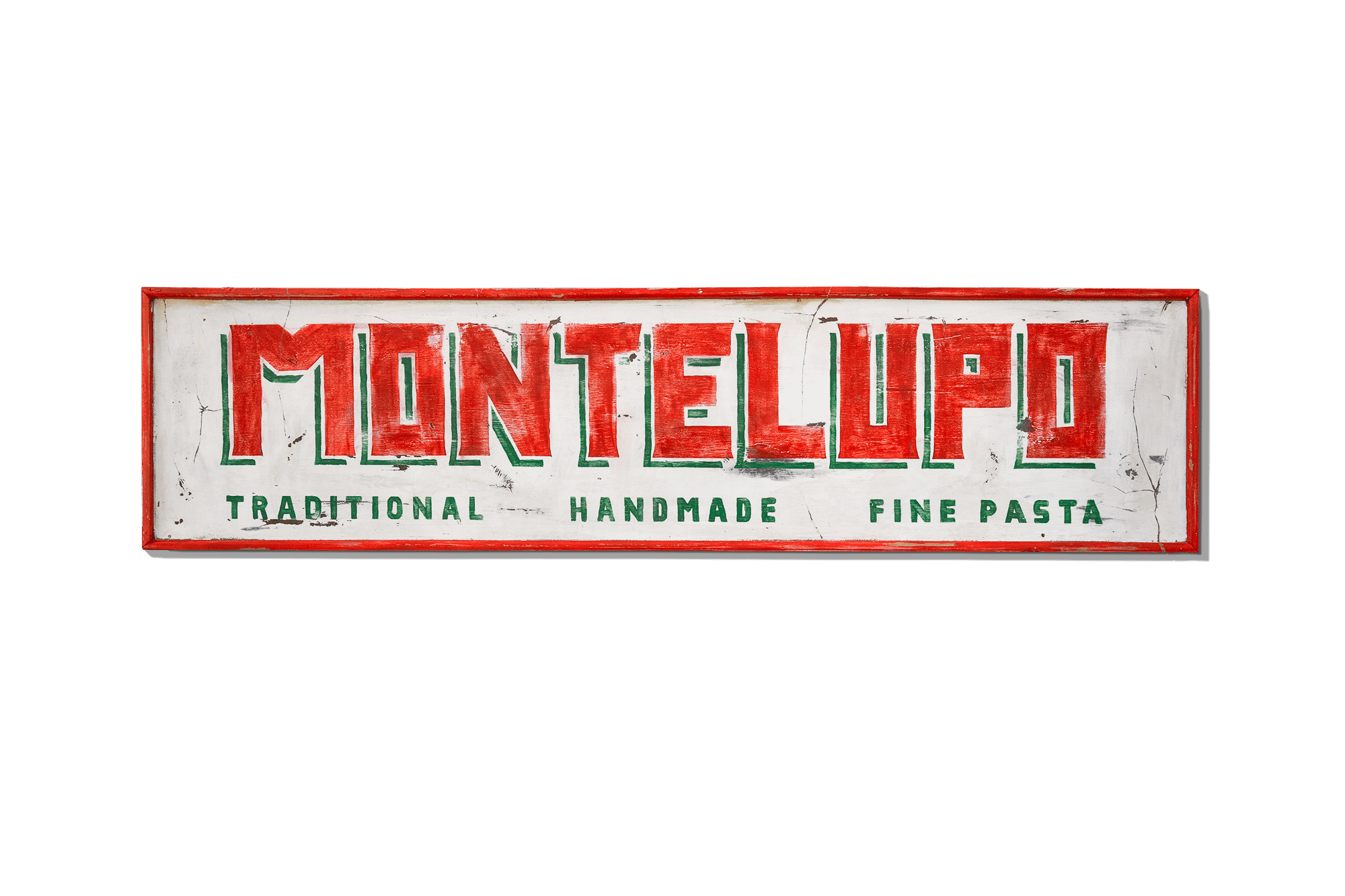 Vintage-style Montelupo painted sign — 'Traditional Handmade Fine Pasta' in red and green on weathered white wood