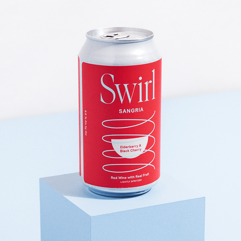 Single Swirl Sangria Elderberry and Black Cherry red can on a light blue surface