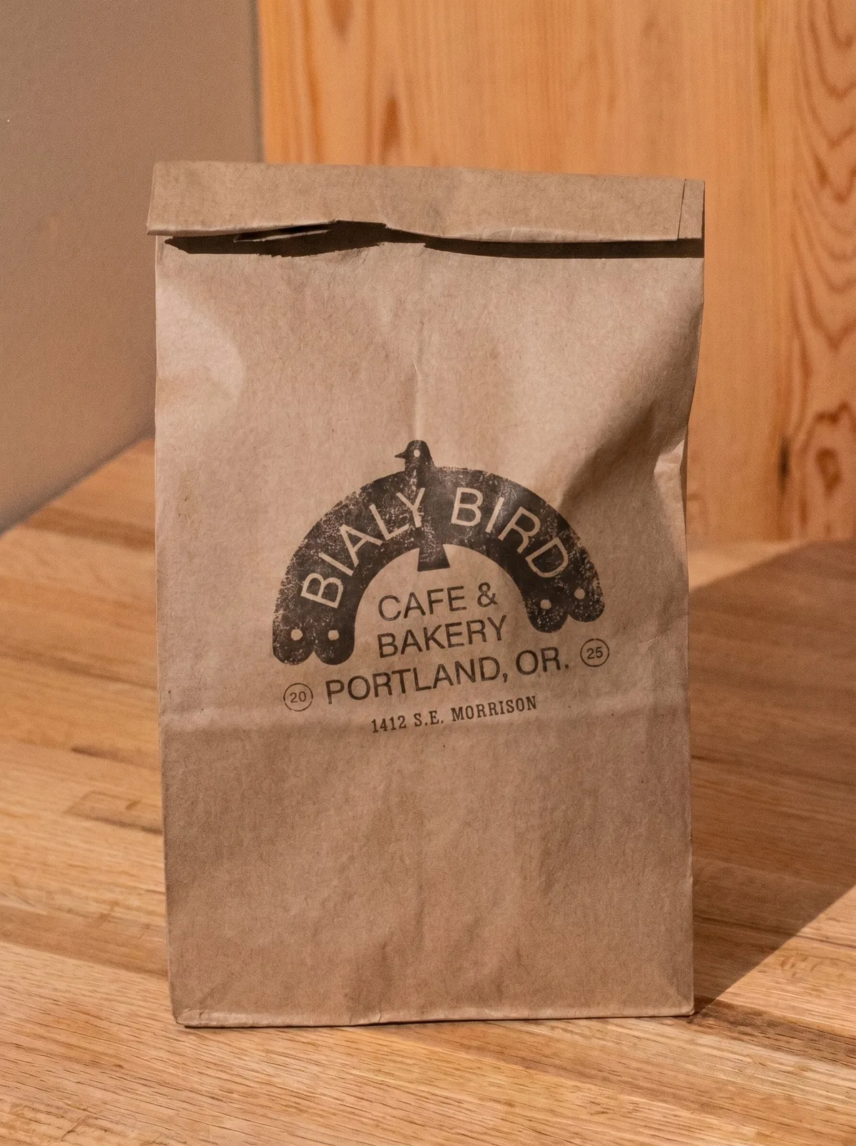 Bialy Bird kraft bag with stamp logo mark