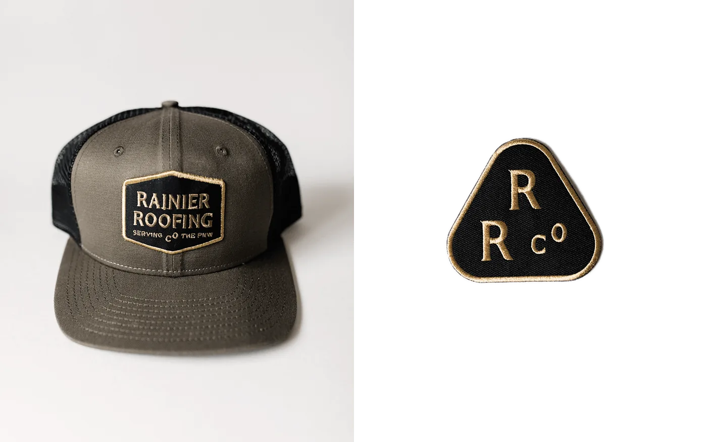 Rainier Roofing olive trucker hat and black enamel R/R Co. logo pin side by side on white
