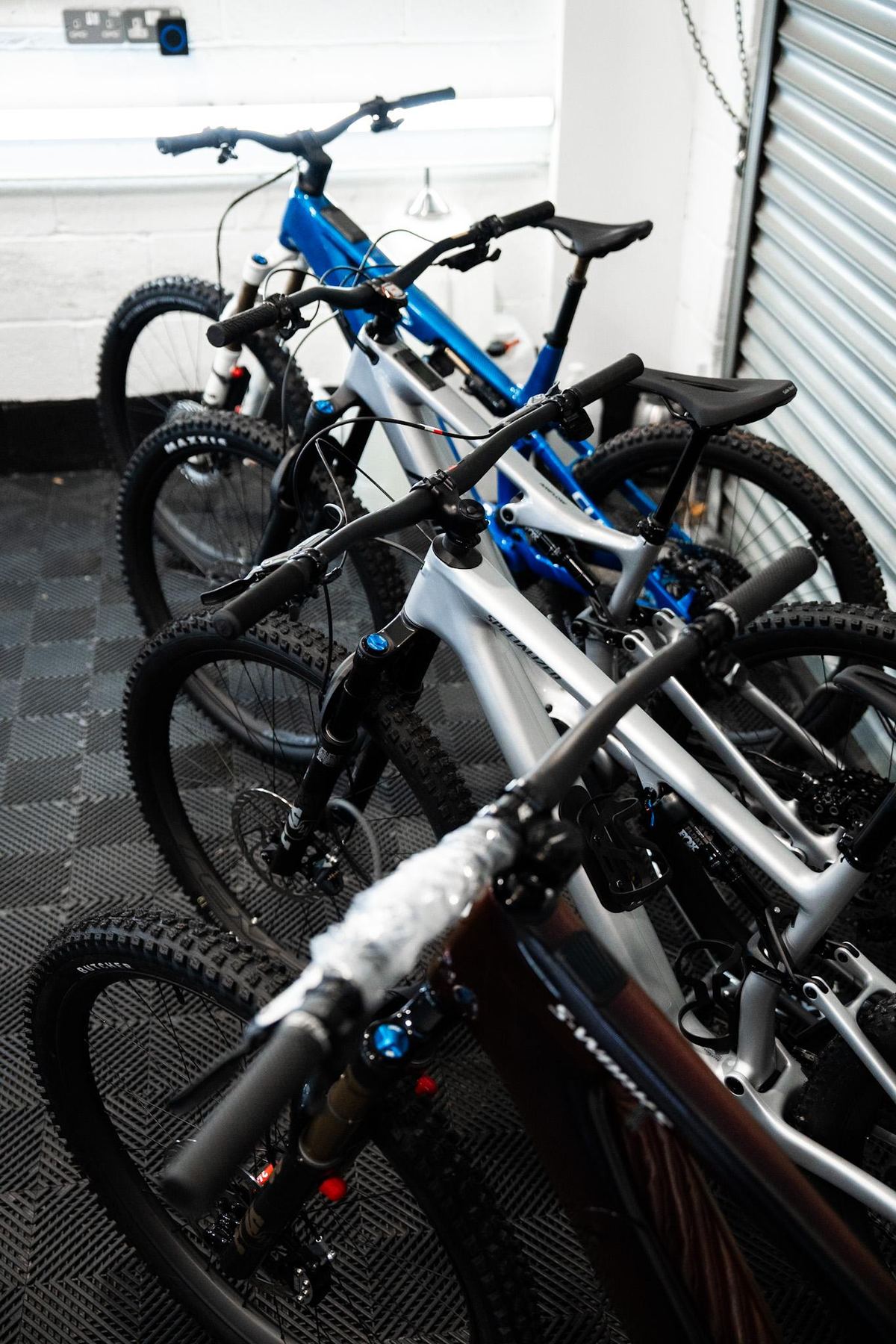 Line of mountain bikes awaiting paint protection film