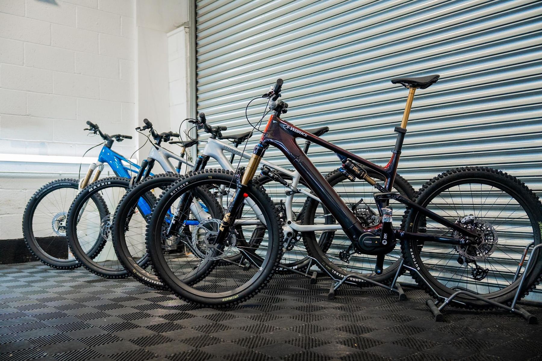 Row of premium mountain bikes in the Refined Detail unit