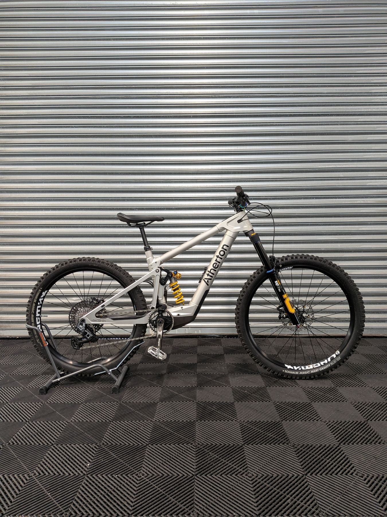 Atherton electric mountain bike with raw aluminium frame